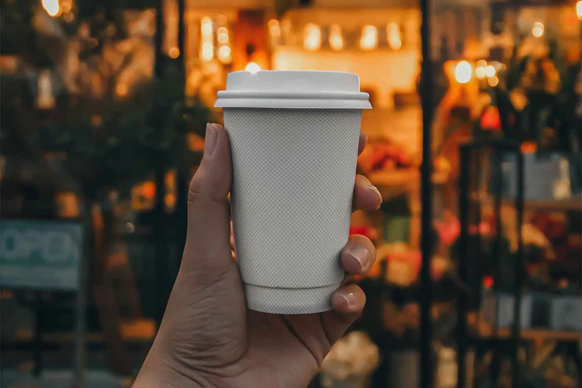 Coffee Cup in Hand Mockup